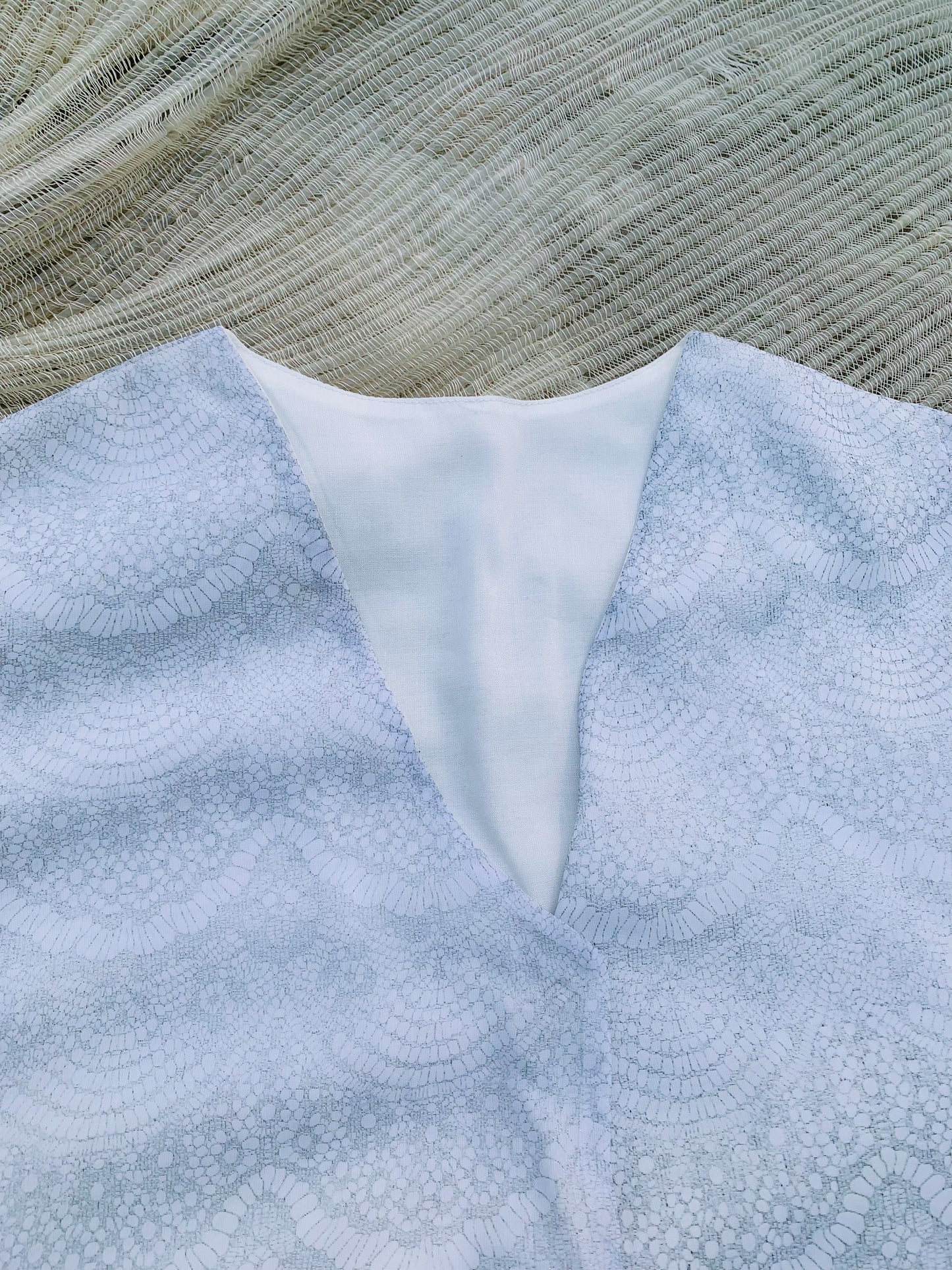v-neckline- winter clothing-white fabric-